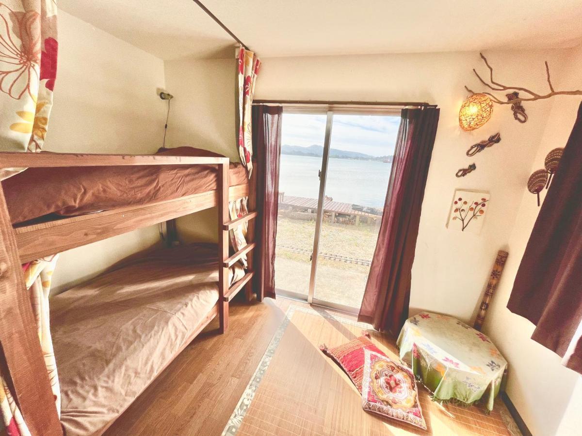 Guest House Waraemon Nago Exterior foto